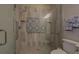 Walk-in shower with patterned tile and grab bars at 5601 Atlanta Hwy, Rutledge, GA 30663