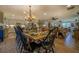 Open concept dining room with a farmhouse table and hardwood floors at 5601 Atlanta Hwy, Rutledge, GA 30663