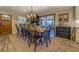 Farmhouse-style dining room with large wooden table and black chairs at 5601 Atlanta Hwy, Rutledge, GA 30663
