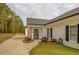 Home exterior showcasing a charming front entrance with landscaping at 5601 Atlanta Hwy, Rutledge, GA 30663