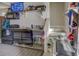Garage bar with stainless steel sink and mini-fridge at 5601 Atlanta Hwy, Rutledge, GA 30663