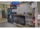 Garage bar with stainless steel sink and mini-fridge at 5601 Atlanta Hwy, Rutledge, GA 30663