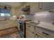 Modern kitchen with white cabinets and stainless steel appliances at 5601 Atlanta Hwy, Rutledge, GA 30663