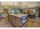 Spacious kitchen featuring an island, stainless steel appliances, and ample cabinetry at 5601 Atlanta Hwy, Rutledge, GA 30663