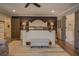 Spacious main bedroom with a large bed, dark accent wall, and ensuite bathroom access at 5601 Atlanta Hwy, Rutledge, GA 30663