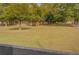 Open pasture with trees and a wooden fence at 5601 Atlanta Hwy, Rutledge, GA 30663