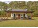 Outdoor patio with seating and grilling area at 5601 Atlanta Hwy, Rutledge, GA 30663