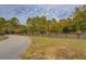 Landscaped yard with a long black fence at 5601 Atlanta Hwy, Rutledge, GA 30663