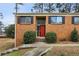 Brick ranch home with red front door and landscaping at 3344 Northcrest Rd # A, Atlanta, GA 30340