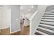 Modern staircase with dark wood treads and white risers at 1592 Jacobs Way, Stone Mountain, GA 30083