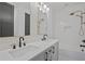 Bathroom boasts double vanity, white subway tile, and a walk-in shower at 2910 Caney Parc Way, Cumming, GA 30041