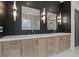 Elegant bathroom boasts double vanity, quartz countertop and dark tile at 2910 Caney Parc Way, Cumming, GA 30041
