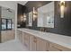 Spa-like bathroom with double vanity, quartz countertop, and dark tile at 2910 Caney Parc Way, Cumming, GA 30041