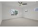 Spacious bedroom with ceiling fan and large window offering natural light at 2910 Caney Parc Way, Cumming, GA 30041