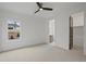 Bright bedroom with window, en-suite bathroom access, and walk-in closet at 2910 Caney Parc Way, Cumming, GA 30041