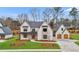 Two-story house with gray roof, white siding, and a two-car garage at 2910 Caney Parc Way, Cumming, GA 30041