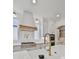 Modern kitchen with white cabinets, a gold faucet, and a marble countertop at 2910 Caney Parc Way, Cumming, GA 30041