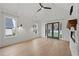 Bright living room featuring hardwood floors, fireplace, and French doors leading to backyard at 2910 Caney Parc Way, Cumming, GA 30041