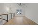 Bright loft with hardwood floors, a window overlooking the backyard, and a ceiling fan at 2910 Caney Parc Way, Cumming, GA 30041