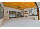 Covered patio features an outdoor fireplace and access to the pool at 2910 Caney Parc Way, Cumming, GA 30041