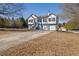 Two-story house with gray siding, two car garage, and a long driveway at 3601 Brookview Dr, Loganville, GA 30052