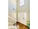 Bright entryway with hardwood floors, a staircase, and high ceilings at 6467 Battery Pt, Stone Mountain, GA 30087