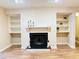 Cozy basement fireplace with built-in shelving at 1011 Dunbar Dr, Atlanta, GA 30338