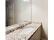 Bathroom boasts granite countertop and updated vanity at 1011 Dunbar Dr, Atlanta, GA 30338