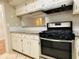 Modern kitchen featuring granite countertops and a gas range at 1011 Dunbar Dr, Atlanta, GA 30338