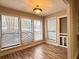 Sunroom with hardwood floors, large windows, and access to exterior at 1011 Dunbar Dr, Atlanta, GA 30338