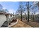 Expansive backyard featuring a deck, steps and pathway leading to natural woodlands at 1412 Dallas Sw Cir, Marietta, GA 30064