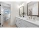 Modern bathroom with double vanity, white cabinets, and neutral decor at 1412 Dallas Sw Cir, Marietta, GA 30064