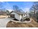 Rear exterior of the house featuring the garage and deck at 1412 Dallas Sw Cir, Marietta, GA 30064