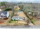 Aerial view of a single story home and large lot featuring mature trees and an outbuilding at 1626 Rice Rd, Lithonia, GA 30058