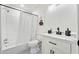 Well-lit bathroom with shower-tub, modern vanity and fixtures, and a clean aesthetic at 1626 Rice Rd, Lithonia, GA 30058