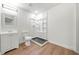 Modern bathroom featuring a shower with a stylish black tile base and vanity at 1626 Rice Rd, Lithonia, GA 30058