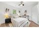 Inviting bedroom featuring a bed with soft linens and stylish wall art at 1626 Rice Rd, Lithonia, GA 30058