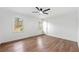 Spacious bedroom with wood floors, ceiling fan, natural light, and closet at 1626 Rice Rd, Lithonia, GA 30058