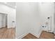 Bright Laundry Room with white walls, hardwood floors, and doorway to the right at 1626 Rice Rd, Lithonia, GA 30058