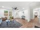 Open-concept living room featuring hardwood floors, neutral tones, and seamless flow to other areas of the home at 1626 Rice Rd, Lithonia, GA 30058