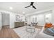 Bright living room with wood floors, a ceiling fan, and modern furnishings at 1626 Rice Rd, Lithonia, GA 30058