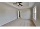 Well-lit bedroom featuring a ceiling fan and en-suite bathroom access at 4668 Snap Creek Ln, Decatur, GA 30035