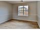 Spacious bedroom with light walls and wood-look flooring at 4668 Snap Creek Ln, Decatur, GA 30035