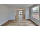 Open dining room with wood-look floors and views to the kitchen at 4668 Snap Creek Ln, Decatur, GA 30035