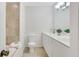 Updated bathroom with double vanity and a bathtub at 4870 Twin Lakes Trl, Atlanta, GA 30360