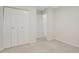 Simple bedroom with double door closet and access to hallway at 4870 Twin Lakes Trl, Atlanta, GA 30360