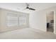 Upstairs bedroom with carpet and ceiling fan at 4870 Twin Lakes Trl, Atlanta, GA 30360