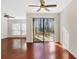 Bright dining room with hardwood floors and sliding glass doors to patio at 4870 Twin Lakes Trl, Atlanta, GA 30360