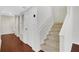 Stairway leading to upper level, hardwood floors at 4870 Twin Lakes Trl, Atlanta, GA 30360