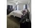 This bedroom features a ceiling fan and a dresser for ample storage at 1507 Wynnes Ridge Se Cir, Marietta, GA 30067